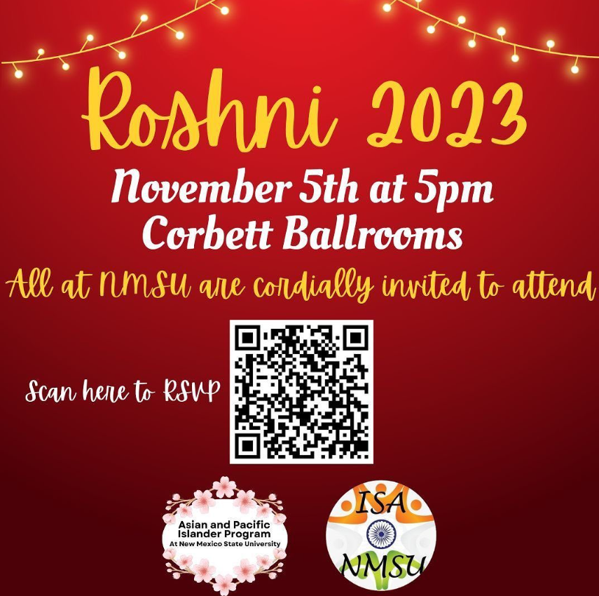 The image is a promotional flyer for an event titled "Roshni 2023." The background is a gradient of red hues with string lights at the top that resemble small, glowing orbs. The primary text, written in a large yellow script font, reads "Roshni 2023." Below it, in white bold text, the date and location of the event are provided: "November 5th at 5pm, Corbett Ballrooms". Further down, a yellow script font text invites the audience: "All at NMSU are cordially invited to attend." Centered below this text is a black and white QR code, underneath which is written "Scan here to RSVP" in white script font. At the bottom, there are two logos. The left logo displays the text "Asian and Pacific Islander Program at New Mexico State University" with a design of pink cherry blossoms around the text. The right logo has the text "ISA NMSU" on a stylized orange and white circular design.