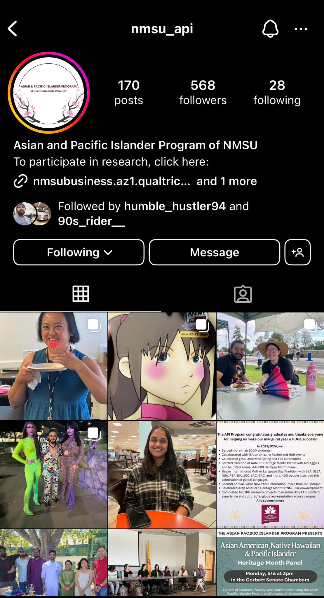 The image is a screenshot of the Instagram profile for "nmsu_api," representing the Asian and Pacific Islander Program at New Mexico State University. The profile has a black background with the username "nmsu_api" displayed in white at the top, followed by several statistics: 170 posts, 568 followers, and 28 following. The profile picture is a circular logo featuring the text "Asian & Pacific Islander Program at New Mexico State University" surrounded by decorative elements resembling cherry blossoms. Below, there is a brief description of the program, a clickable link for research participation, and two follower profiles. The screen displays six posts arranged in two rows:  First row, left: A person in a blue sleeveless blouse smiles and holds a plate with watermelon. First row, middle: An animated character with short, dark hair, subtly blushing. First row, right: Two people sit outdoors at a table with food, one person holding a multicolored fan. Second row, left: Three people dressed in vibrant and stylish clothing pose together outdoors. Second row, middle: A person with long hair, dressed in a plaid shirt, sits at a table in a library. Second row, right: A text post summarizing the API program's achievements and events. Below these images, another event poster announces an "Asian American, Native Hawaiian & Pacific Islander Heritage Month Panel" scheduled for Monday, 5/6 at 3 PM in the Corbett Senate Chambers.