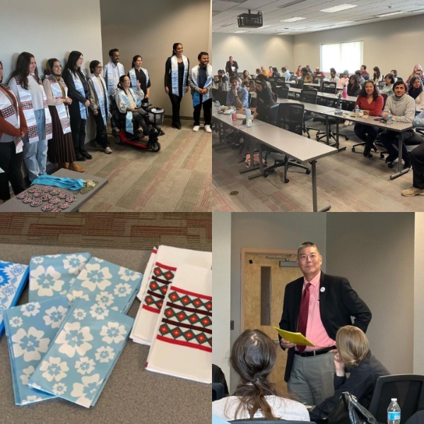 The image consists of a collage of four photographs capturing different moments in an event.  Top-Left Photo: A group of individuals posing indoors. The individuals, a mix of standing and seated, are dressed in attire that includes blue sashes over their shoulders. There are various decorative items arranged on the floor before them. Top-Right Photo: A classroom setting with attendees sitting at long tables. The people are paying attention to something or someone off-camera. The room is well-lit with fluorescent lights, and there is a ceiling-mounted projector visible. Bottom-Left Photo: A close-up shot of several notebooks and textiles. The notebooks have blue covers with white floral patterns, and the textiles have red, black, and white geometric designs. Bottom-Right Photo: A person in a red shirt and dark blazer speaking in front of an audience. The speaker is holding yellow paper. Behind the speaker, a wooden door and part of a wall are visible. Some audience members are partially visible in the foreground, facing the speaker.